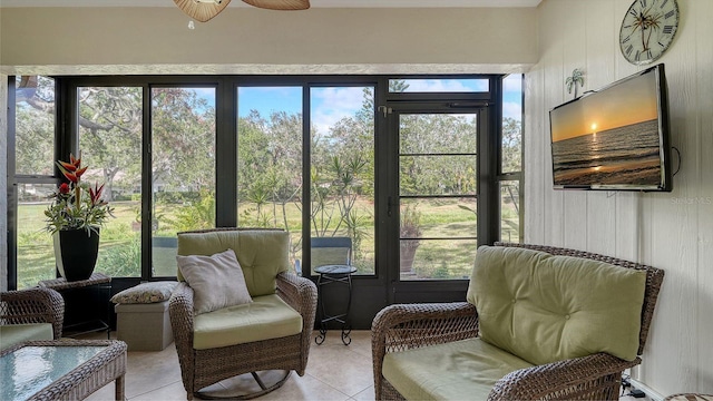 sunroom / solarium with a wealth of natural light and ceiling fan