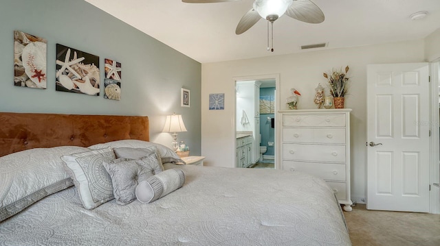 bedroom featuring ensuite bath, ceiling fan, and light tile patterned flooring