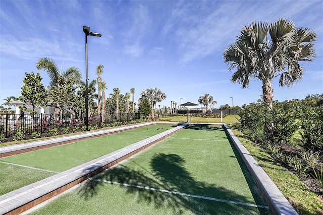 view of home's community with fence