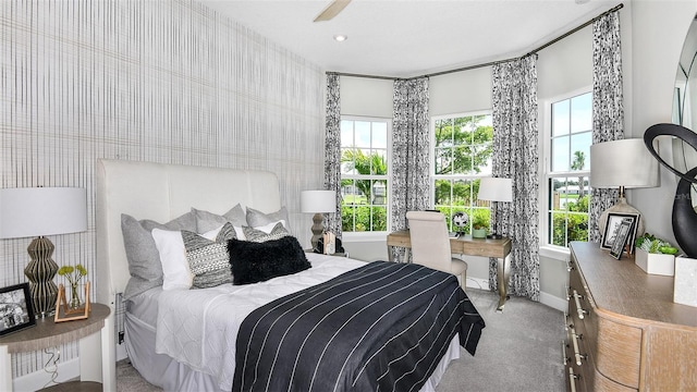 carpeted bedroom with ceiling fan