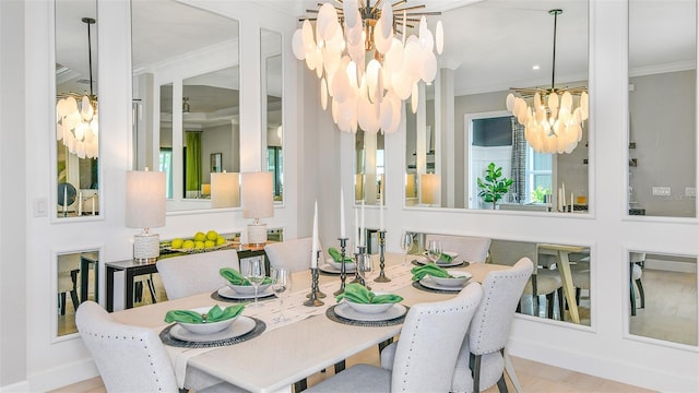 dining area with an inviting chandelier, light wood-type flooring, and ornamental molding