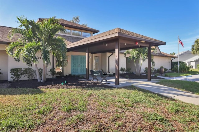 view of front of home featuring a front yard