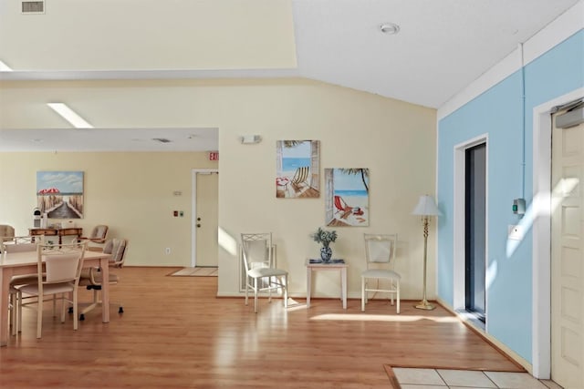 entryway featuring light hardwood / wood-style floors and lofted ceiling