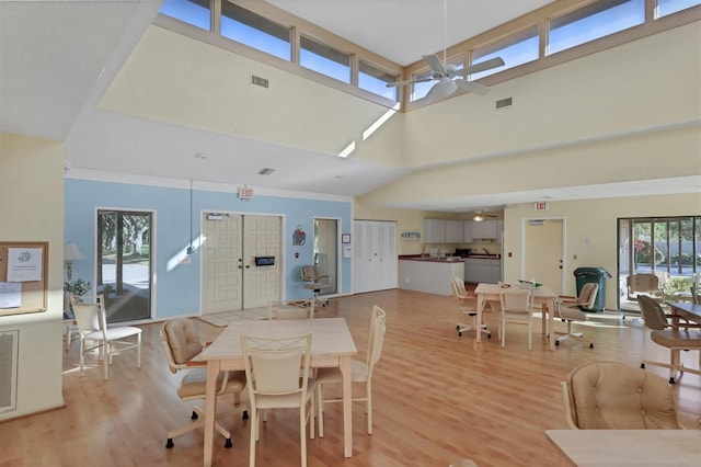 dining area featuring light wood-type flooring and ceiling fan