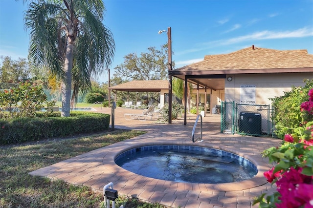 view of swimming pool with a patio area, a gazebo, and a community hot tub