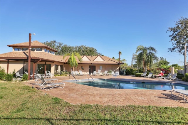 view of swimming pool with a patio area