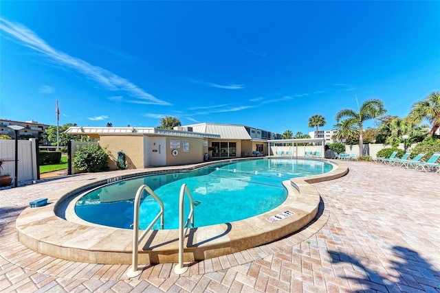 view of swimming pool with a patio area