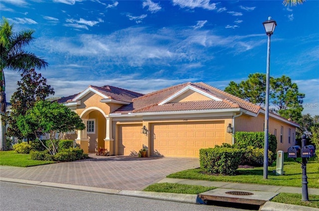 mediterranean / spanish-style house featuring a garage