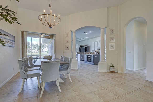 tiled dining space featuring a notable chandelier