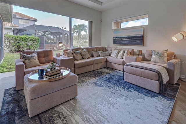 living room with a healthy amount of sunlight and dark hardwood / wood-style floors