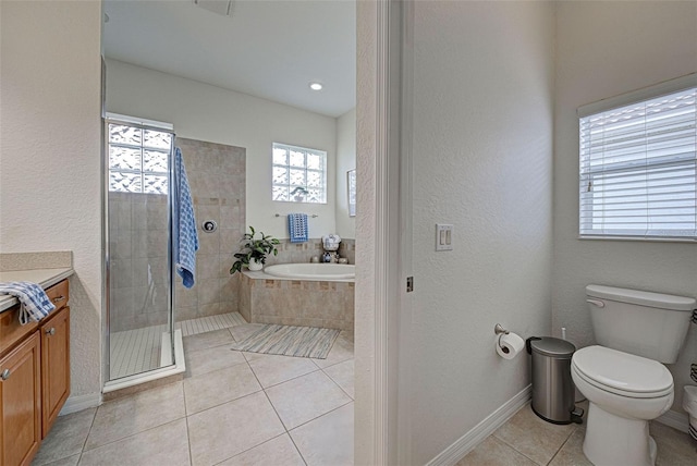 full bathroom with independent shower and bath, vanity, tile patterned floors, and toilet