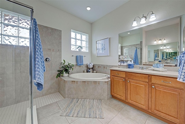 bathroom with vanity, tile patterned flooring, and separate shower and tub