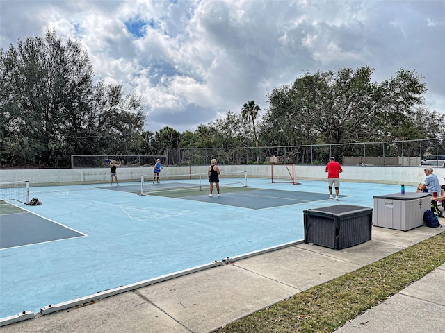 view of tennis court featuring basketball court