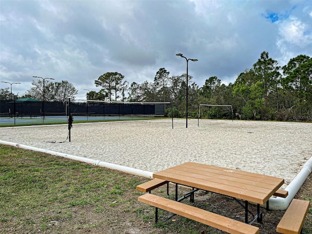 view of home's community featuring volleyball court