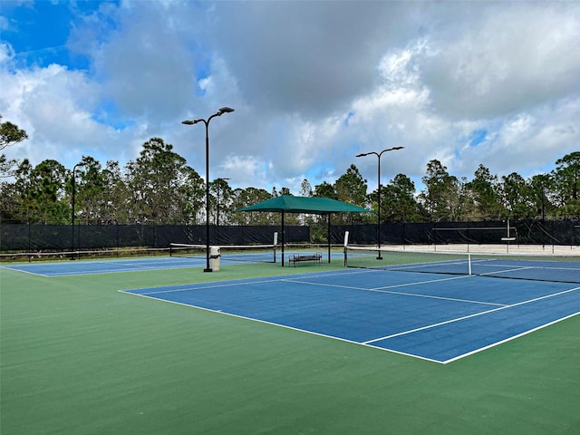 view of sport court with basketball hoop