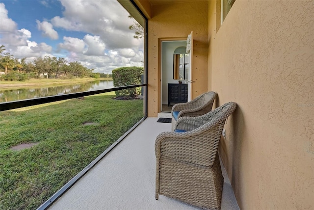 balcony featuring a water view