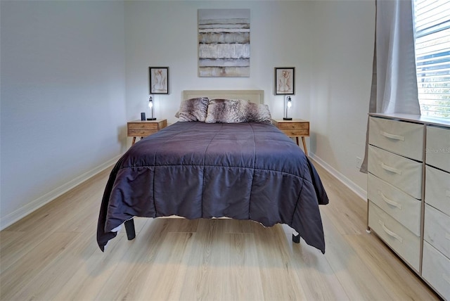 bedroom with light hardwood / wood-style floors