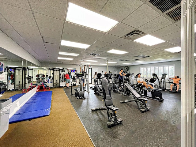 workout area with a drop ceiling