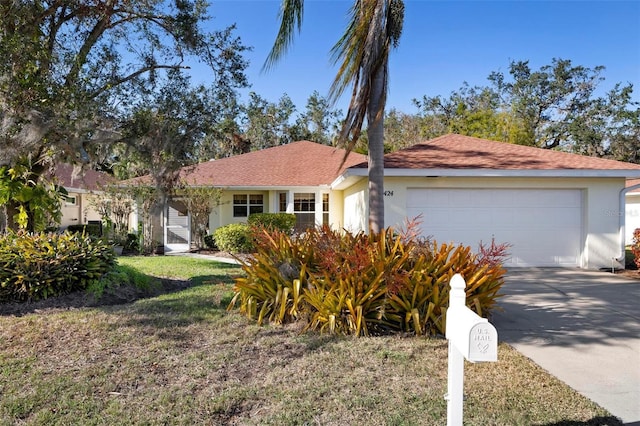 ranch-style home featuring a garage