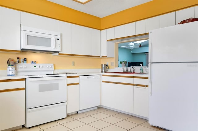 kitchen featuring white cabinets, white appliances, sink, and a textured ceiling