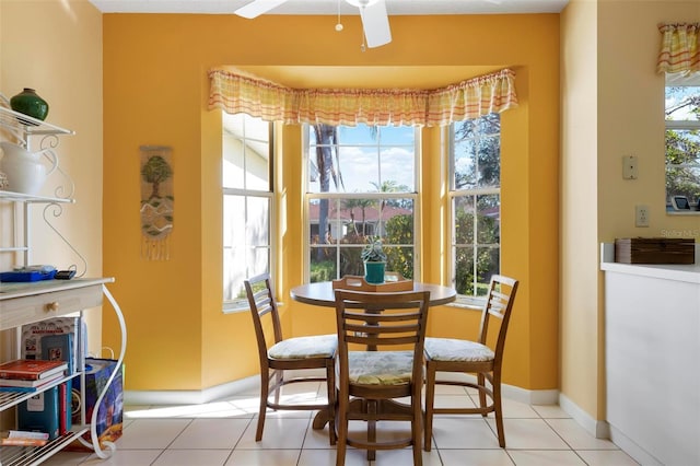 dining area featuring ceiling fan and light tile patterned floors