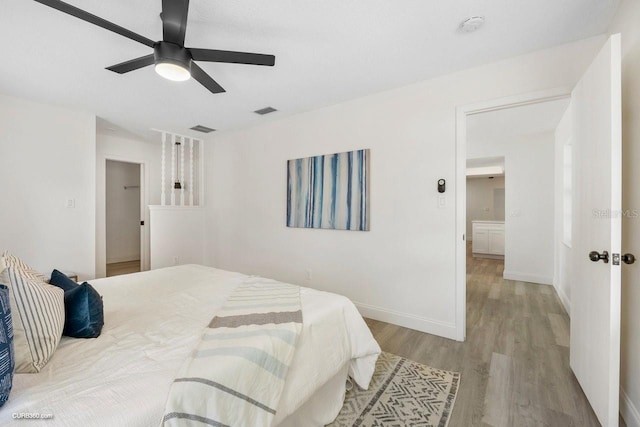 bedroom with ceiling fan and light wood-type flooring