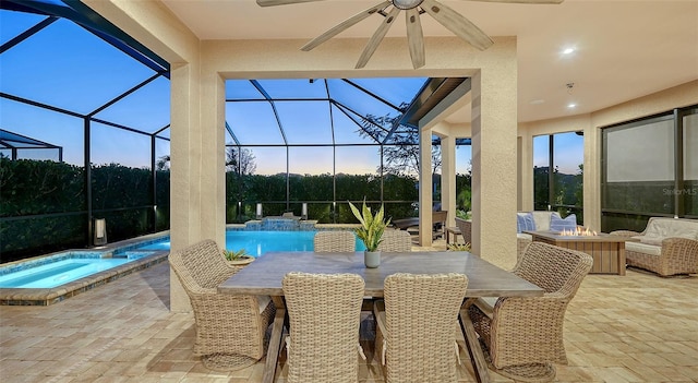 exterior space with a pool with connected hot tub, ceiling fan, glass enclosure, outdoor lounge area, and outdoor dining space