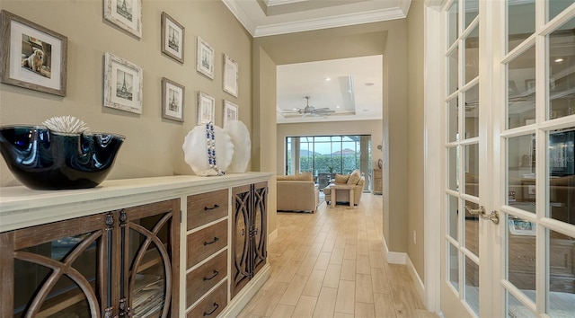 hallway with french doors and ornamental molding