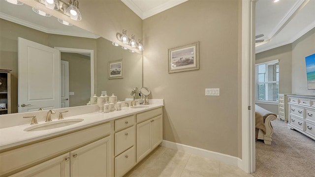 bathroom with tile patterned flooring, vanity, and crown molding