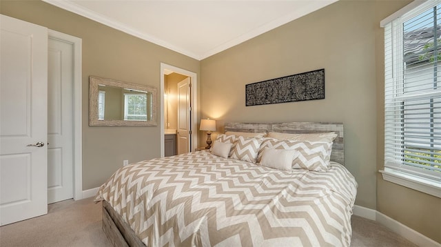 bedroom featuring crown molding and light colored carpet