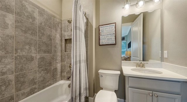 full bathroom featuring shower / tub combo with curtain, vanity, and toilet