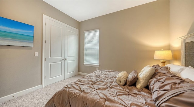 carpeted bedroom featuring a closet