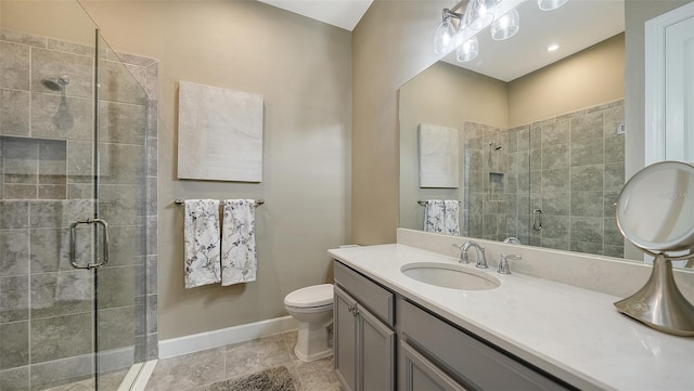 bathroom with vanity, an enclosed shower, and toilet