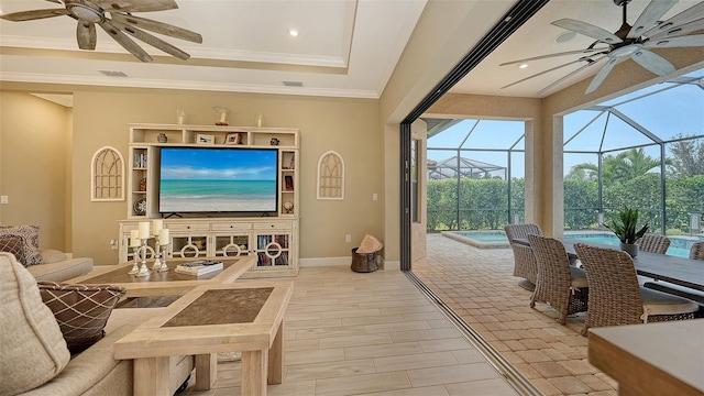 living room featuring a raised ceiling and crown molding