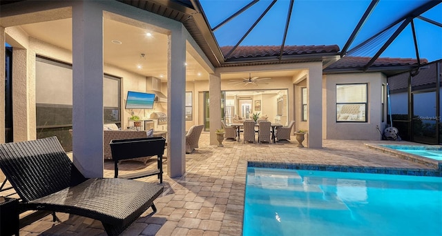 pool featuring ceiling fan, a lanai, outdoor dining space, an in ground hot tub, and a patio