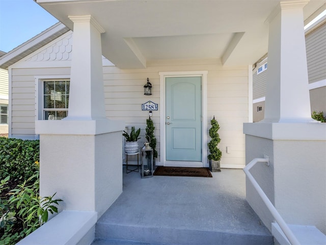 doorway to property with a porch