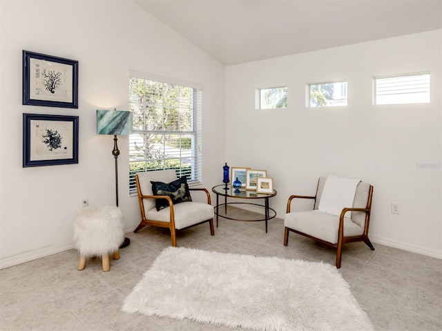 sitting room with vaulted ceiling