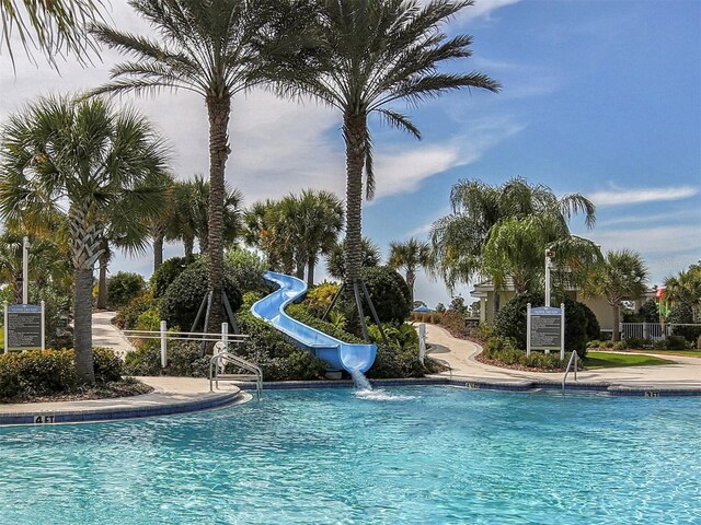 view of swimming pool featuring a water slide