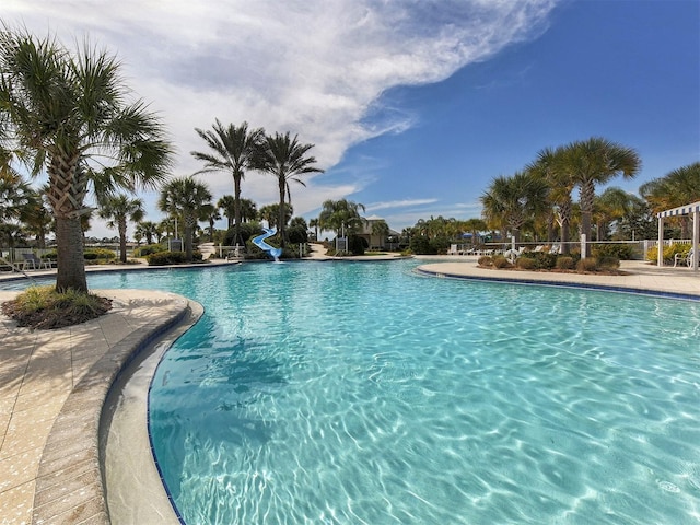 view of pool featuring a water slide