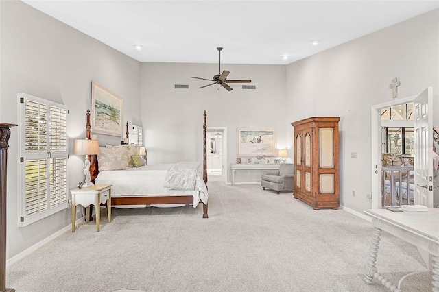 carpeted bedroom featuring ceiling fan, high vaulted ceiling, visible vents, and baseboards