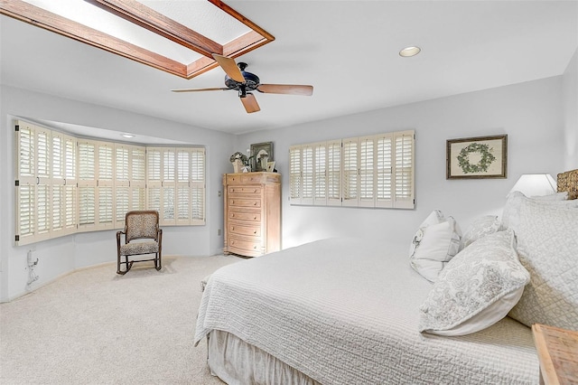 bedroom with carpet floors, a skylight, recessed lighting, and a ceiling fan