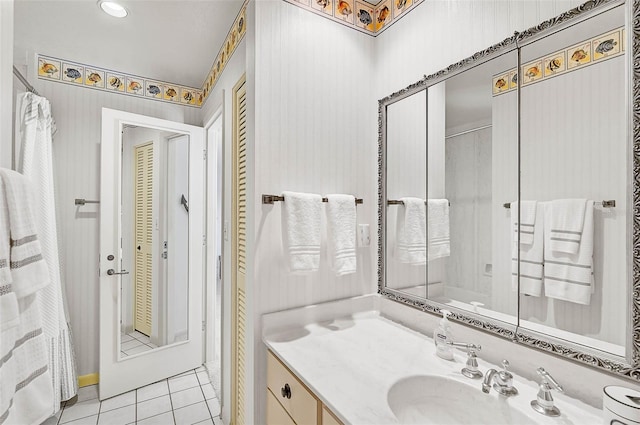 full bathroom with vanity and tile patterned floors