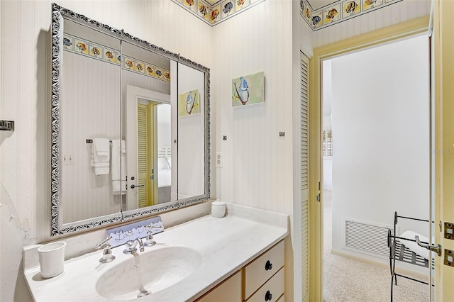 bathroom featuring visible vents and vanity