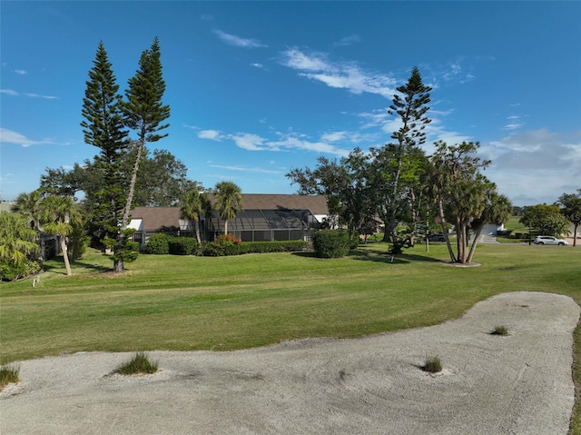 view of home's community with a lawn