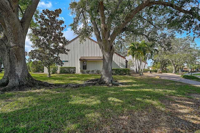 view of home's exterior with a yard