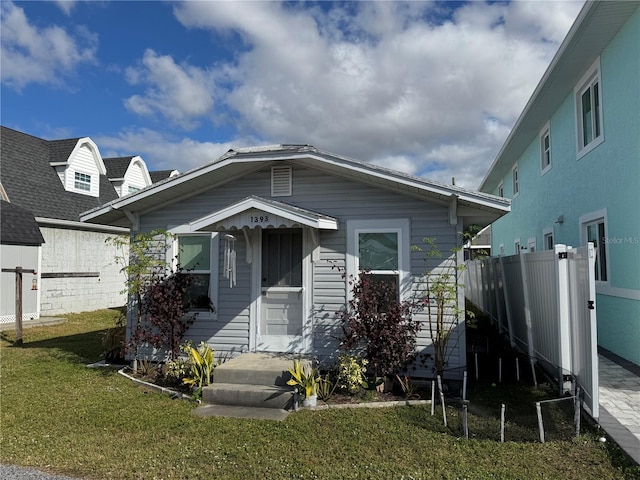 view of front of home with a front lawn