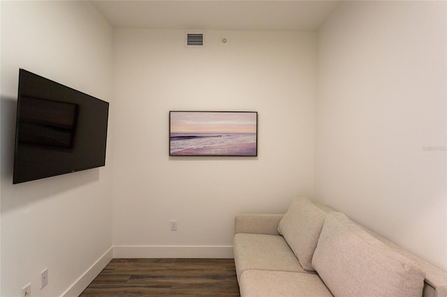 sitting room featuring dark wood-type flooring