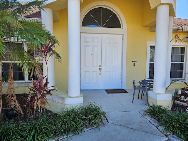 property entrance with covered porch