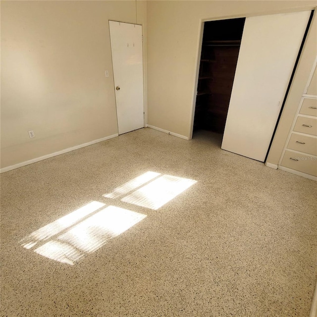 unfurnished bedroom featuring a closet