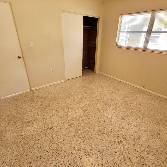 unfurnished bedroom featuring a closet